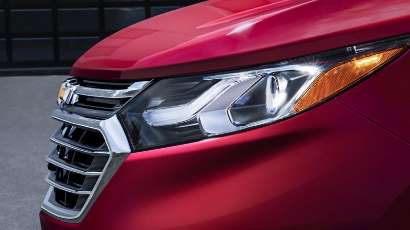 Close-up of the front grille and headlight of the Chevrolet Equinox.