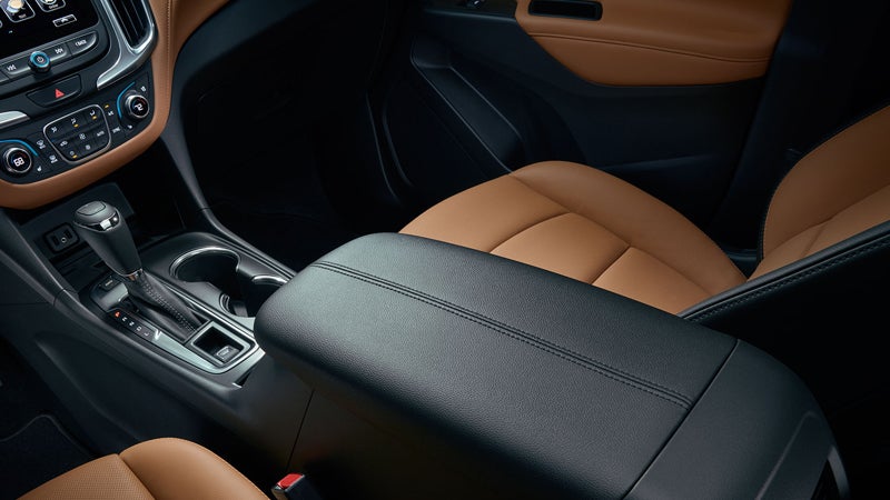 Interior view of the Chevrolet Equinox, showcasing tan leather seats and center console.