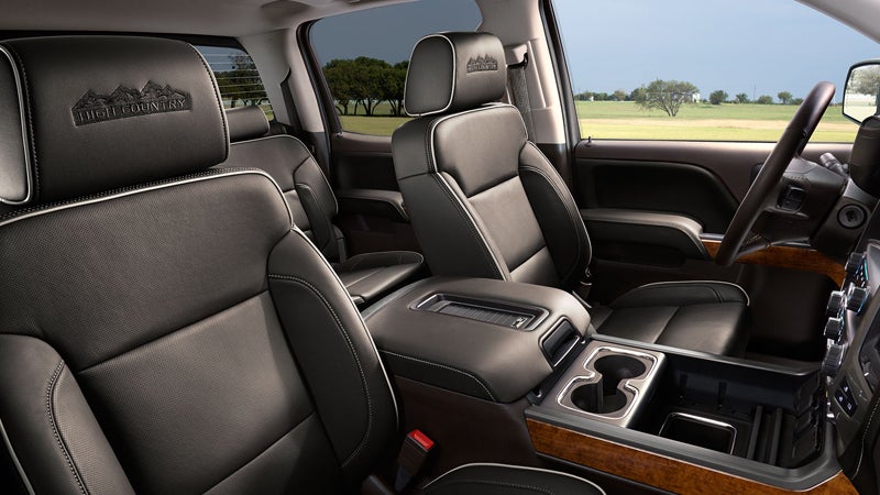 Interior view of a Chevrolet Silverado High Country edition with black leather seats and a premium dashboard.